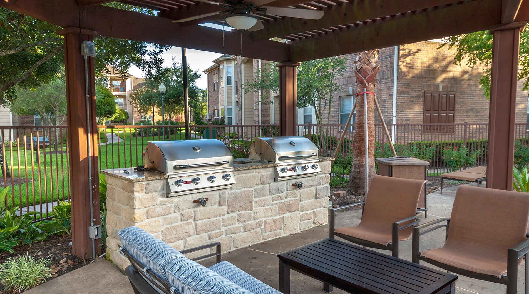 Access to Resident Only Features seating and a table by some grills