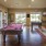 a room with a pool table and chairs