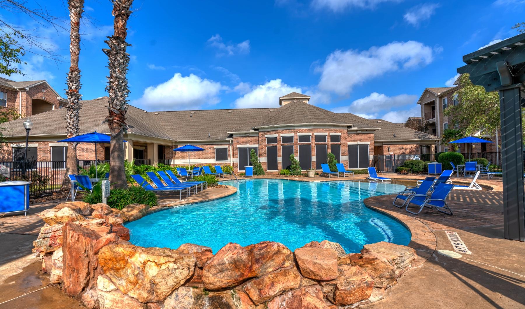 Shimmering resort-style pool a swimming pool in a backyard