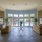 a large lobby with couches and tile flooring