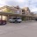 a parking lot with cars and a building in the background