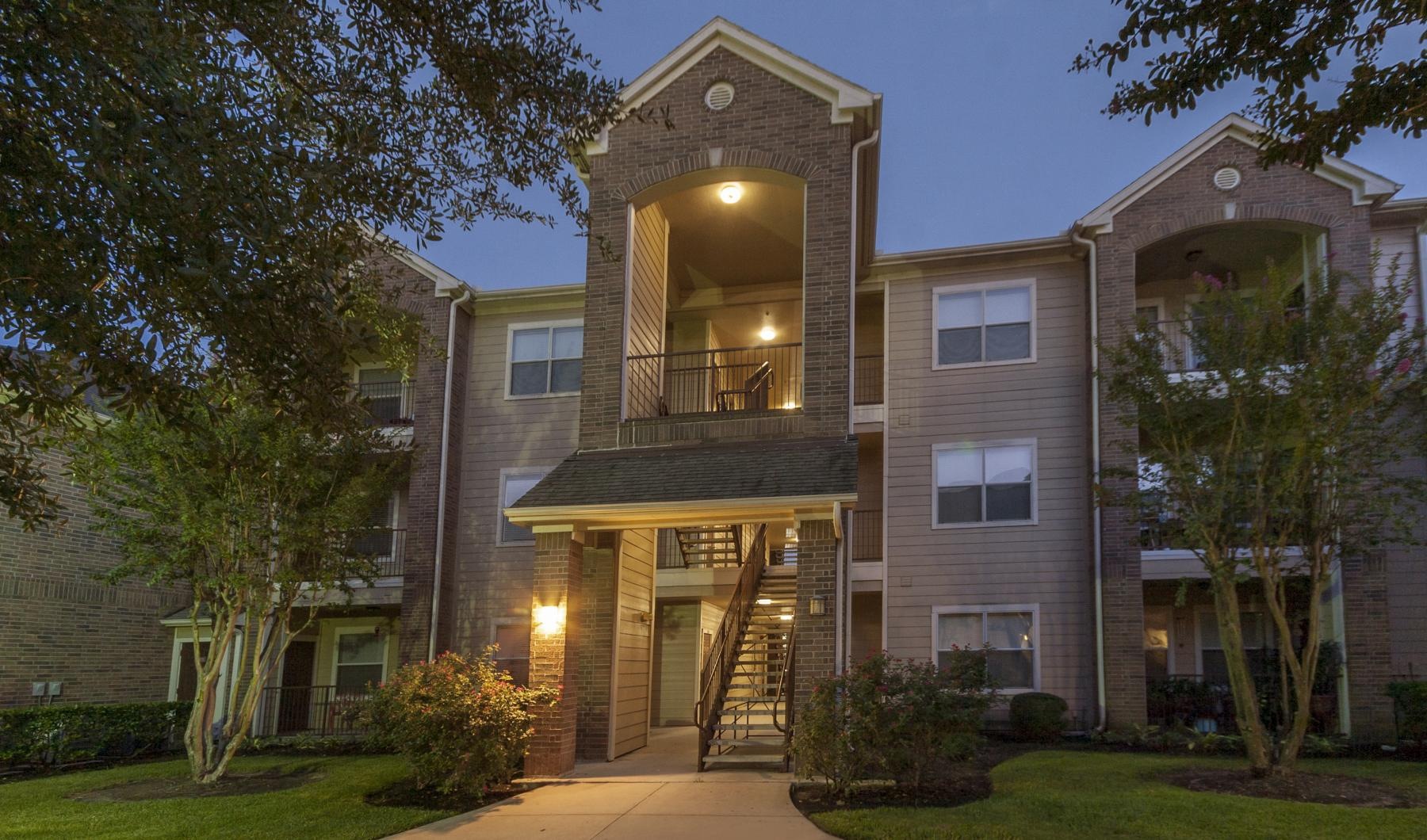 A perfect fit for the whole family a building with a walkway and trees